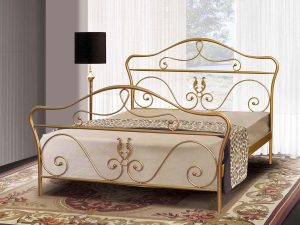 Χρυσό μεταλλικό κρεβάτι με κομψά σχέδια